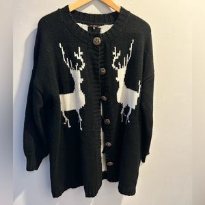 Women’s Christmas sweater!  Black and white size Medium.